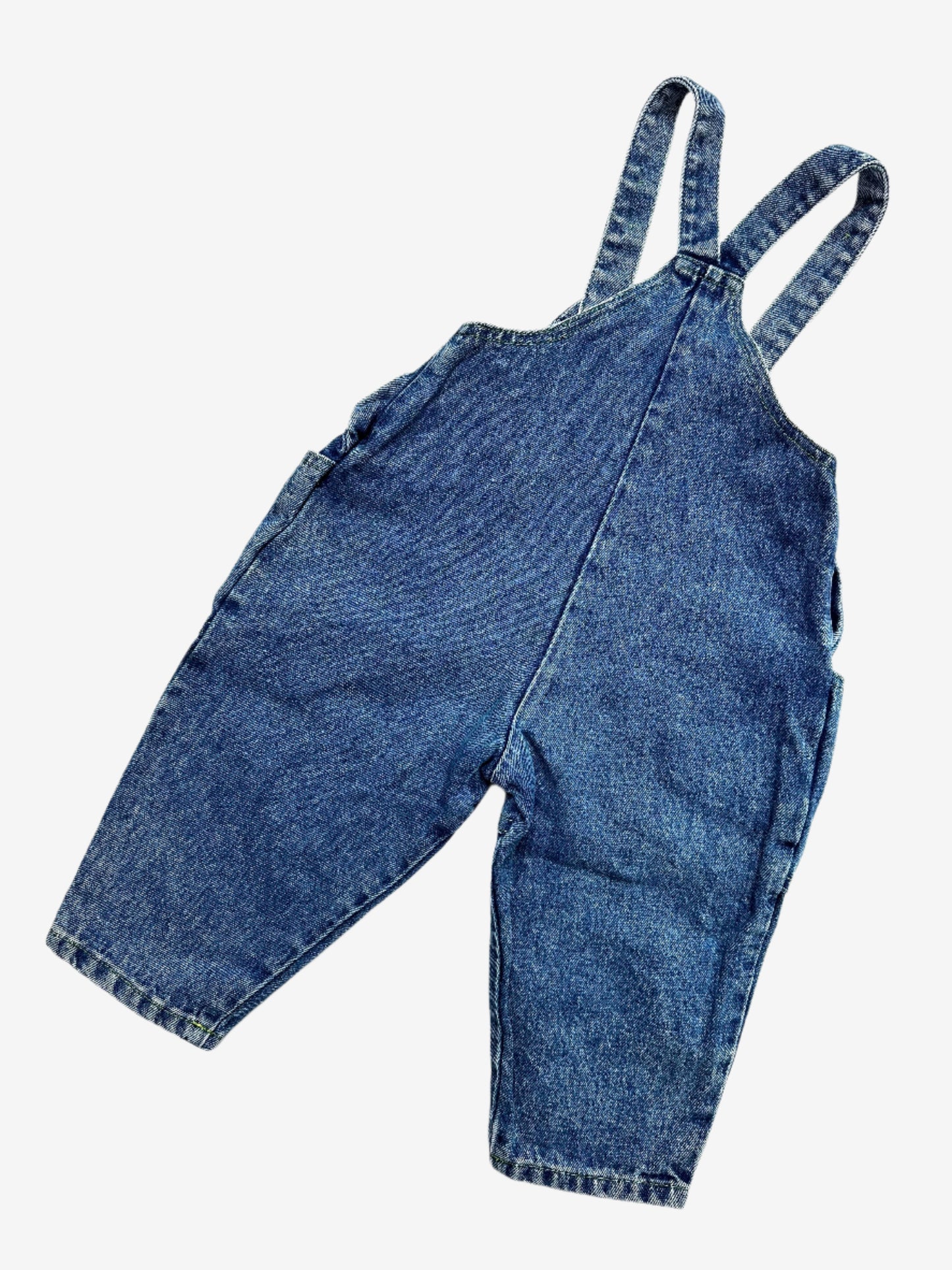 Kids vintage denim dungarees with a fun fluorescent penguin embroidery on the chest and bright pops of colour carried through the buttons and stitching. In a classic mid-blue wash with a relaxed bubble fit, they have gentle gathering at the waist for extra comfort. Age 18 months.