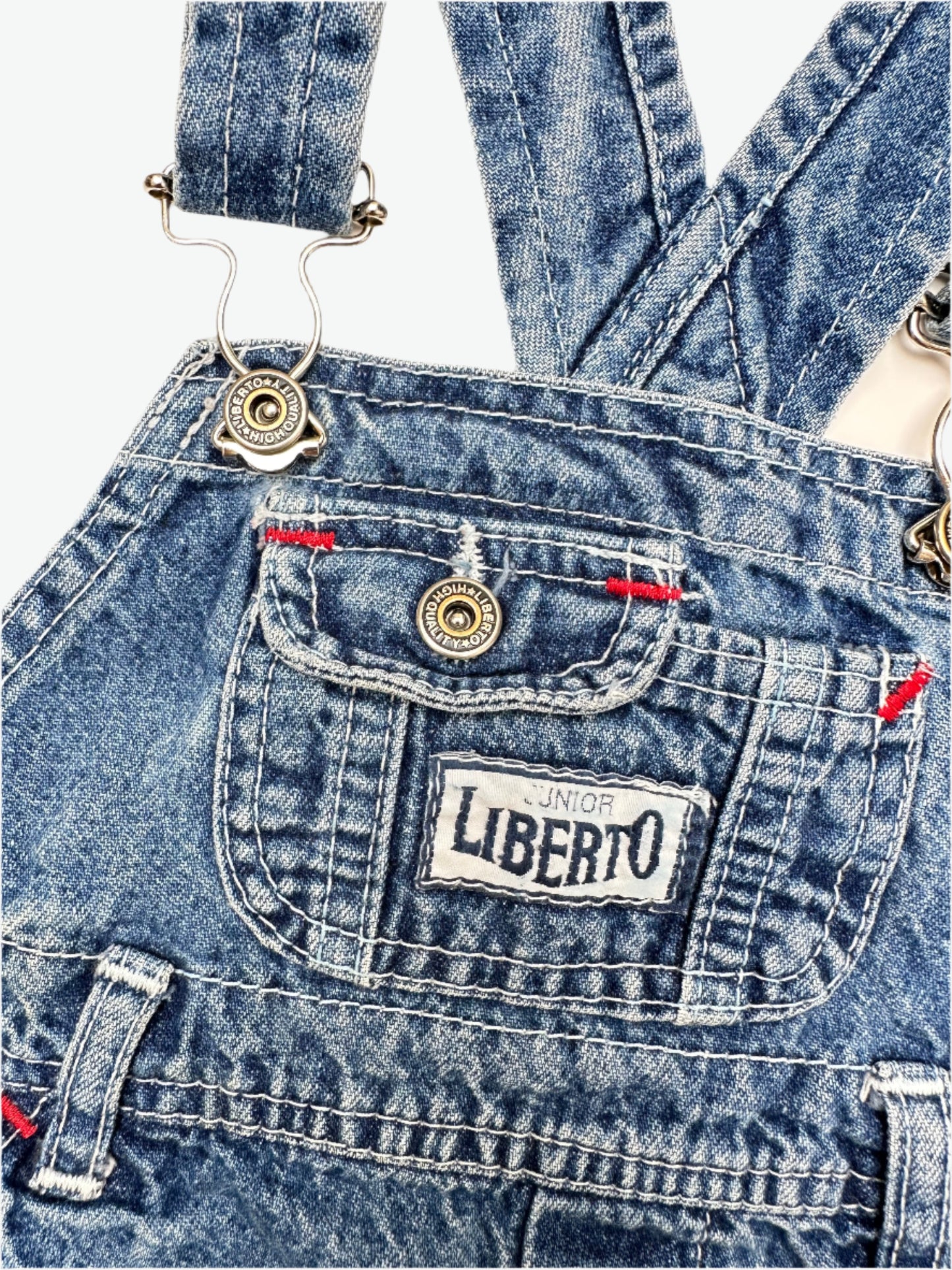 Kids vintage denim dungarees by brand Liberto, true blue denim shade, faded in all the right places. Highlight red bartacks. Age 1 yrs.