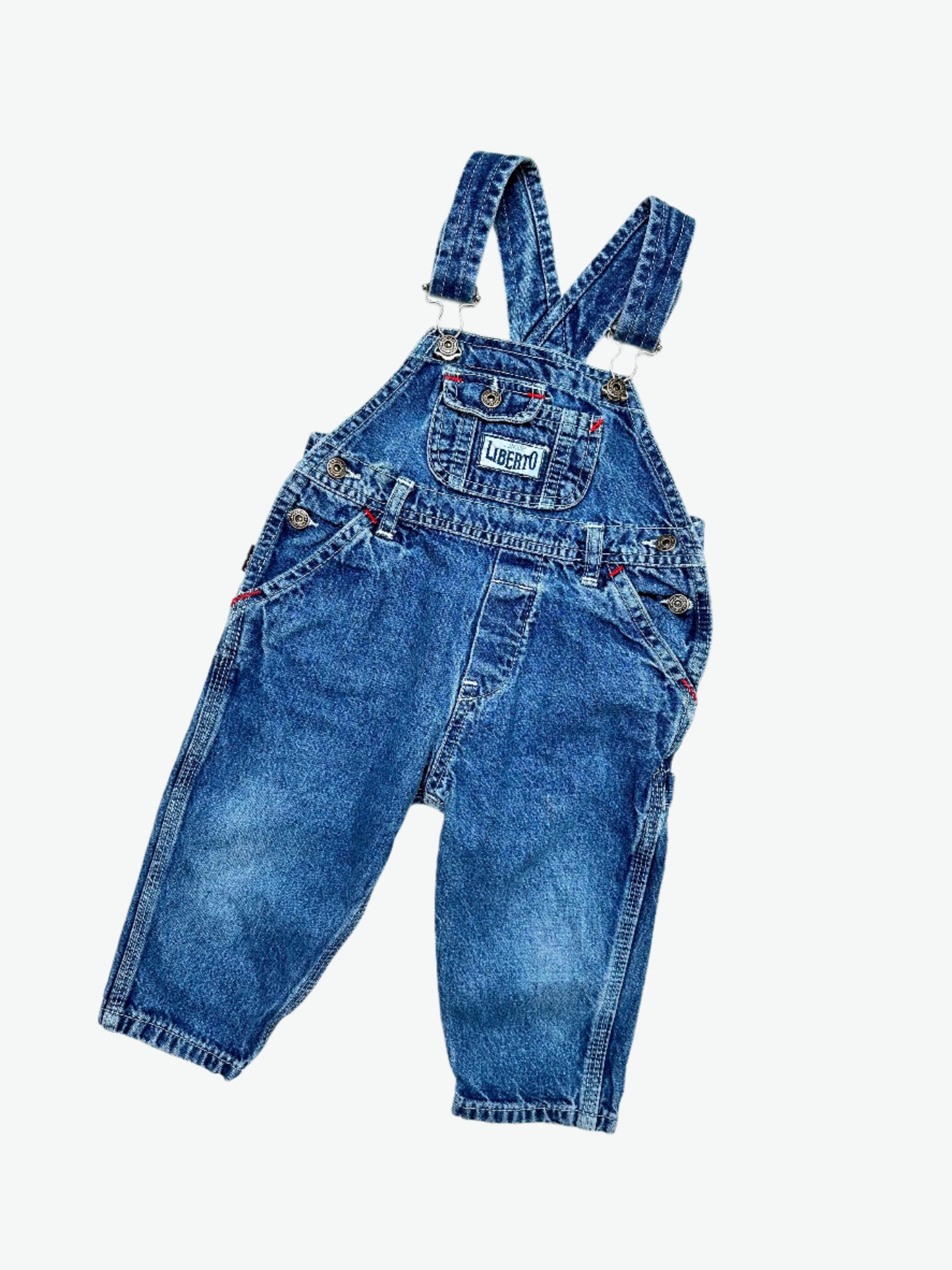 kids vintage denim dungarees by brand Liberto, true blue denim shade, faded in all the right places. Highlight red bartacks. Age 1 yrs.