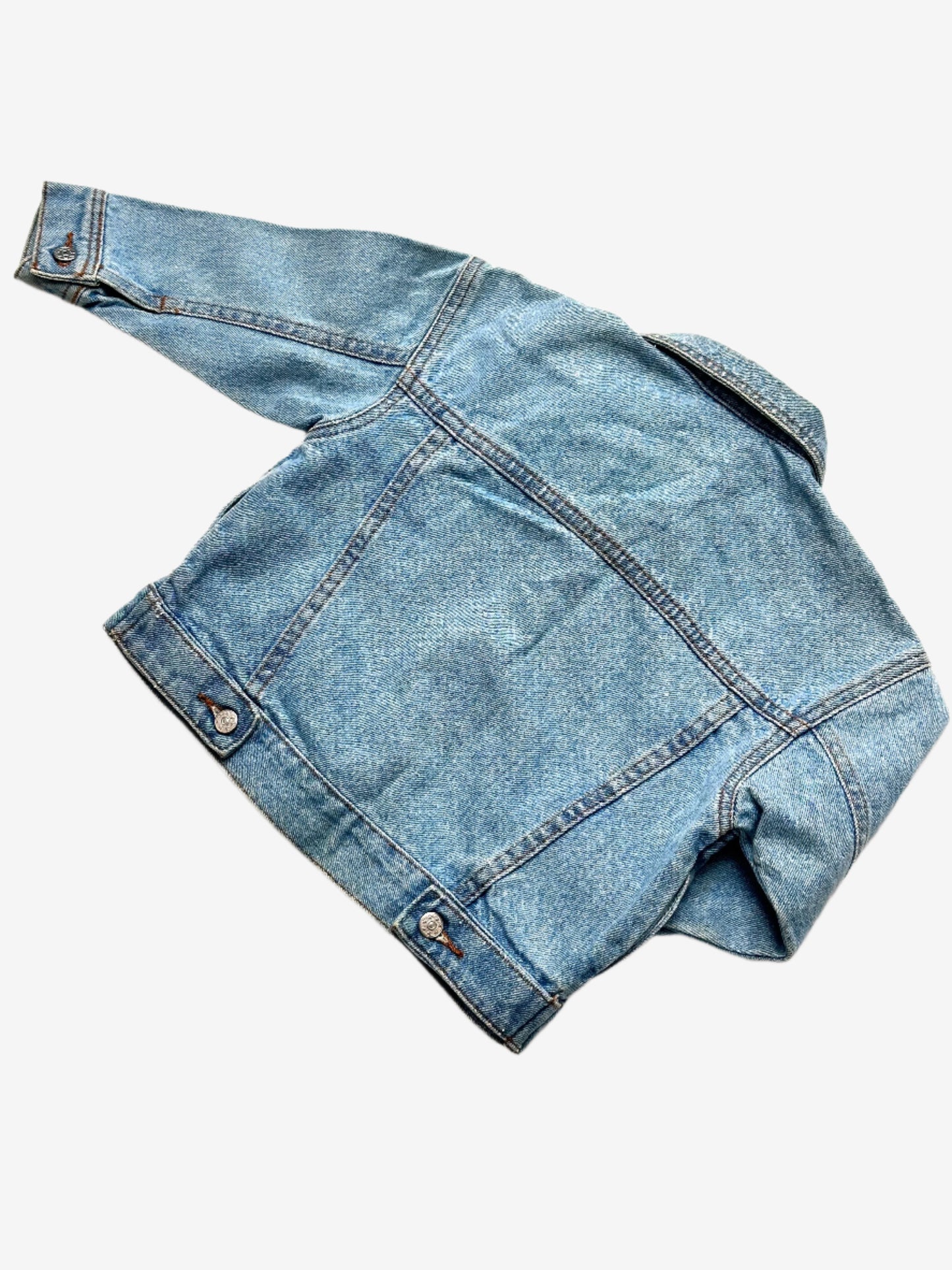 Kids vintage denim jacket A Classic trucker jacket cut, in a light wash with silver buttons. Age 9-12 Months.