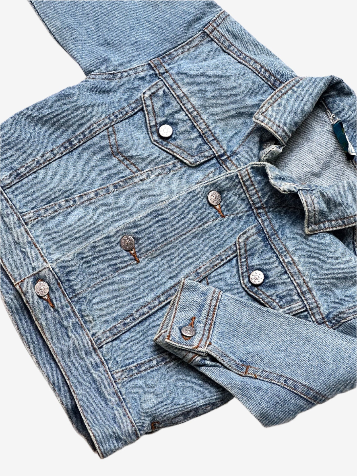 Kids vintage denim jacket A Classic trucker jacket cut, in a light wash with silver buttons. Age 9-12 Months.