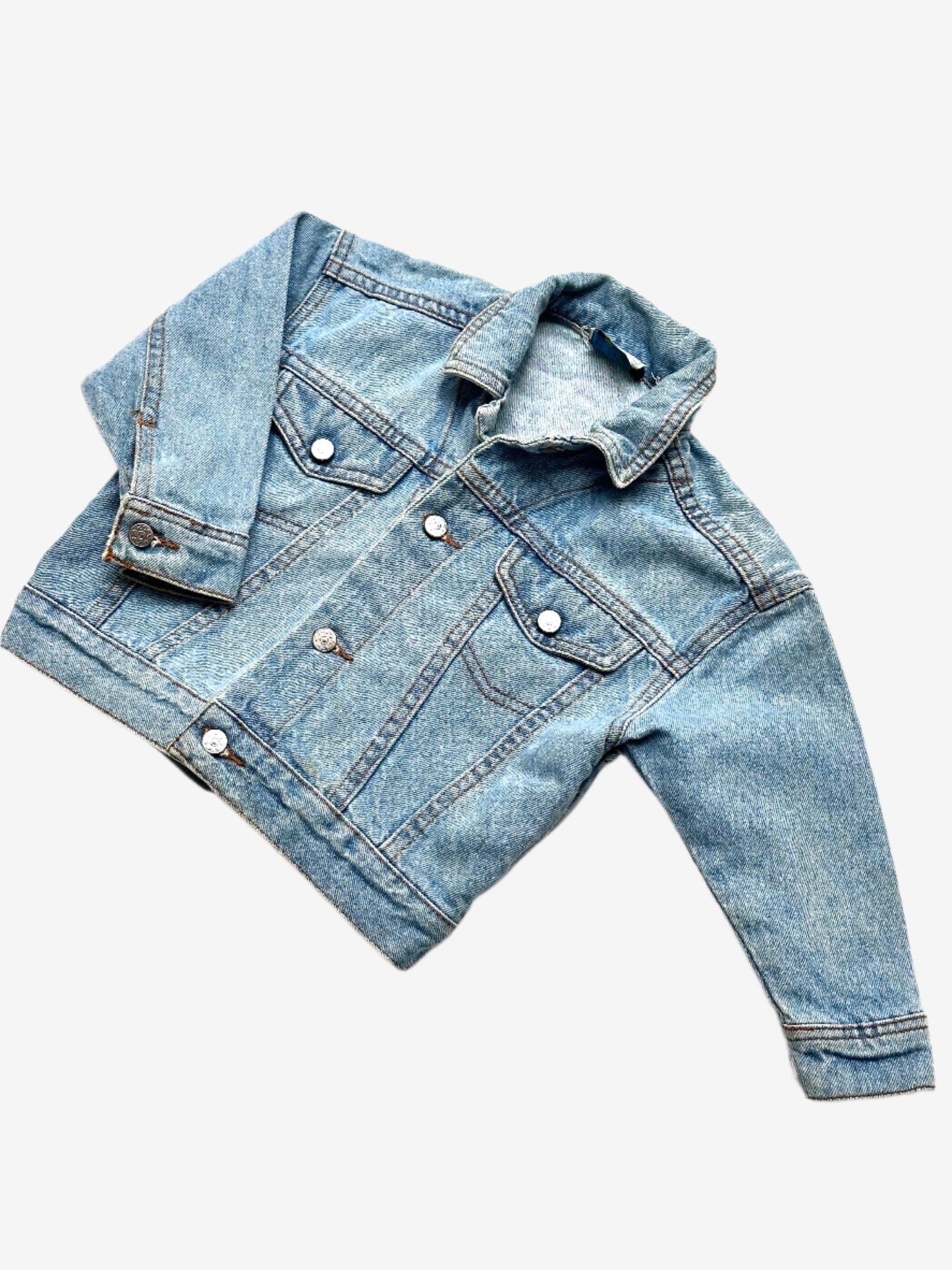 Kids vintage denim jacket A Classic trucker jacket cut, in a light wash with silver buttons. Age 9-12 Months.