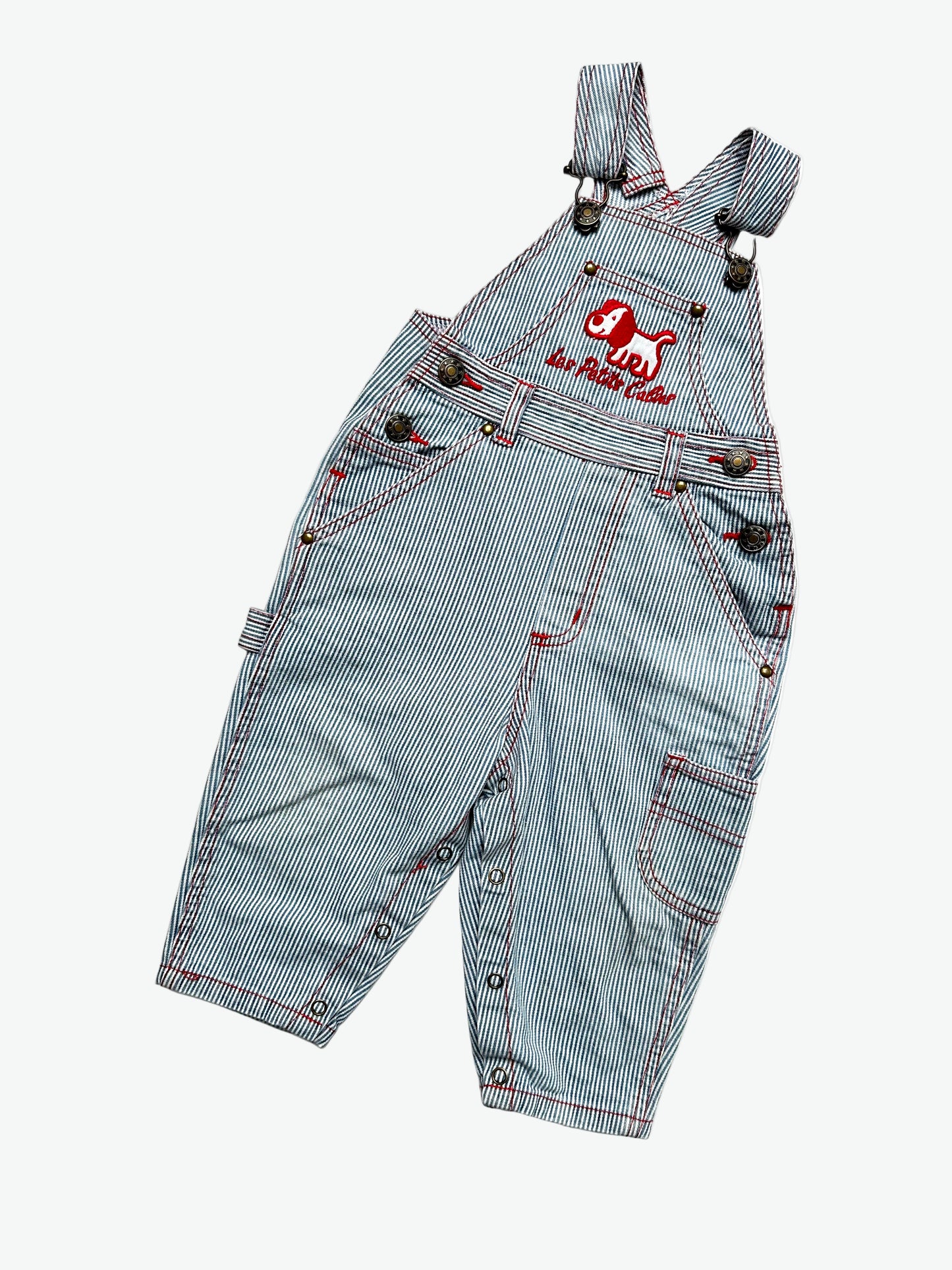 Kids vintage striped dungarees with contrast red stitching and a dog with the words'les petits calins'