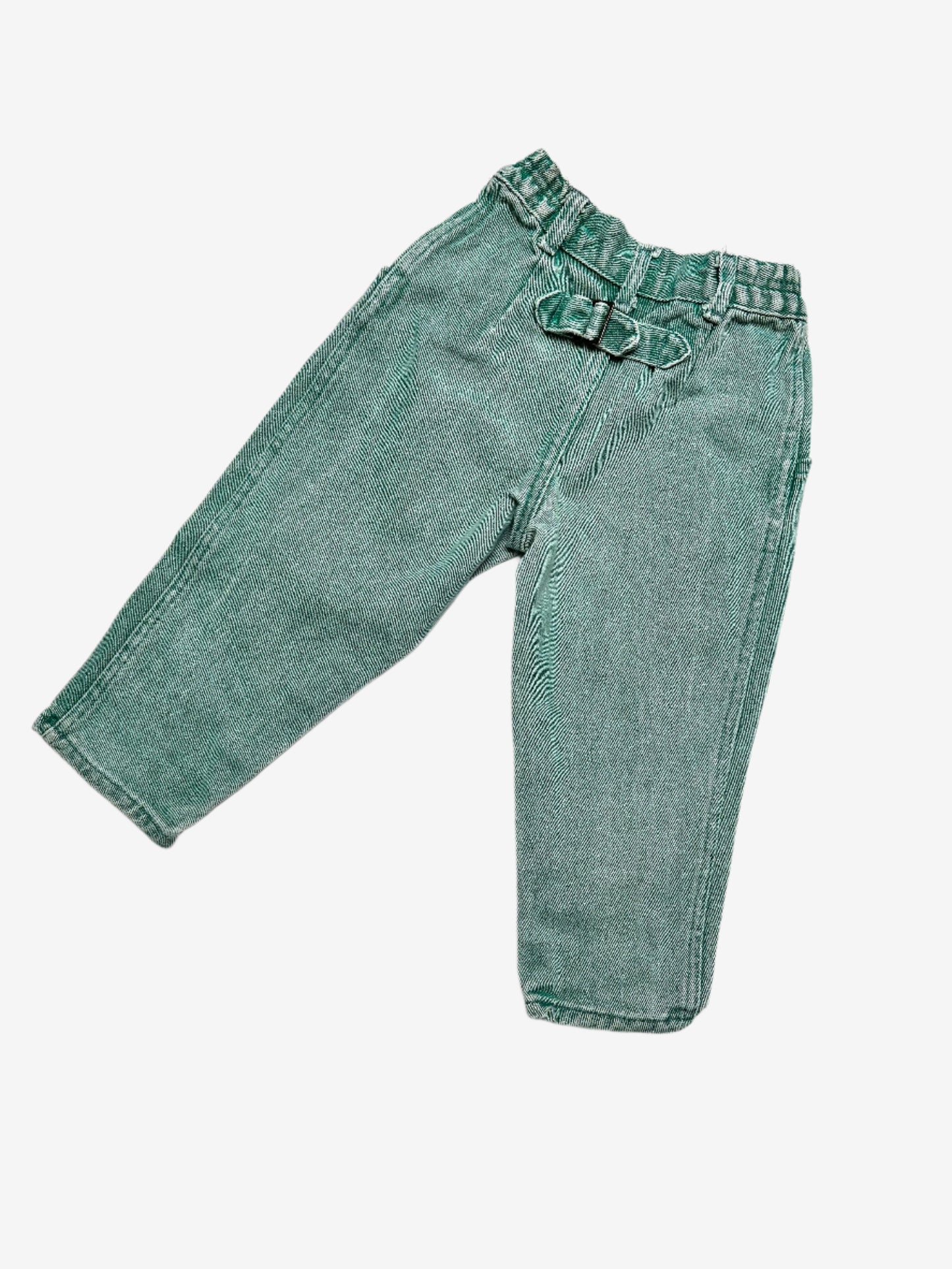 Kids vintage green denim jeans by Kickers, featuring an elasticated waist and button opening for an easy fit, the front darts and extra seams highlight the stunning wash effects, finished with the signature red and green Kickers tabs. Age 2 years.