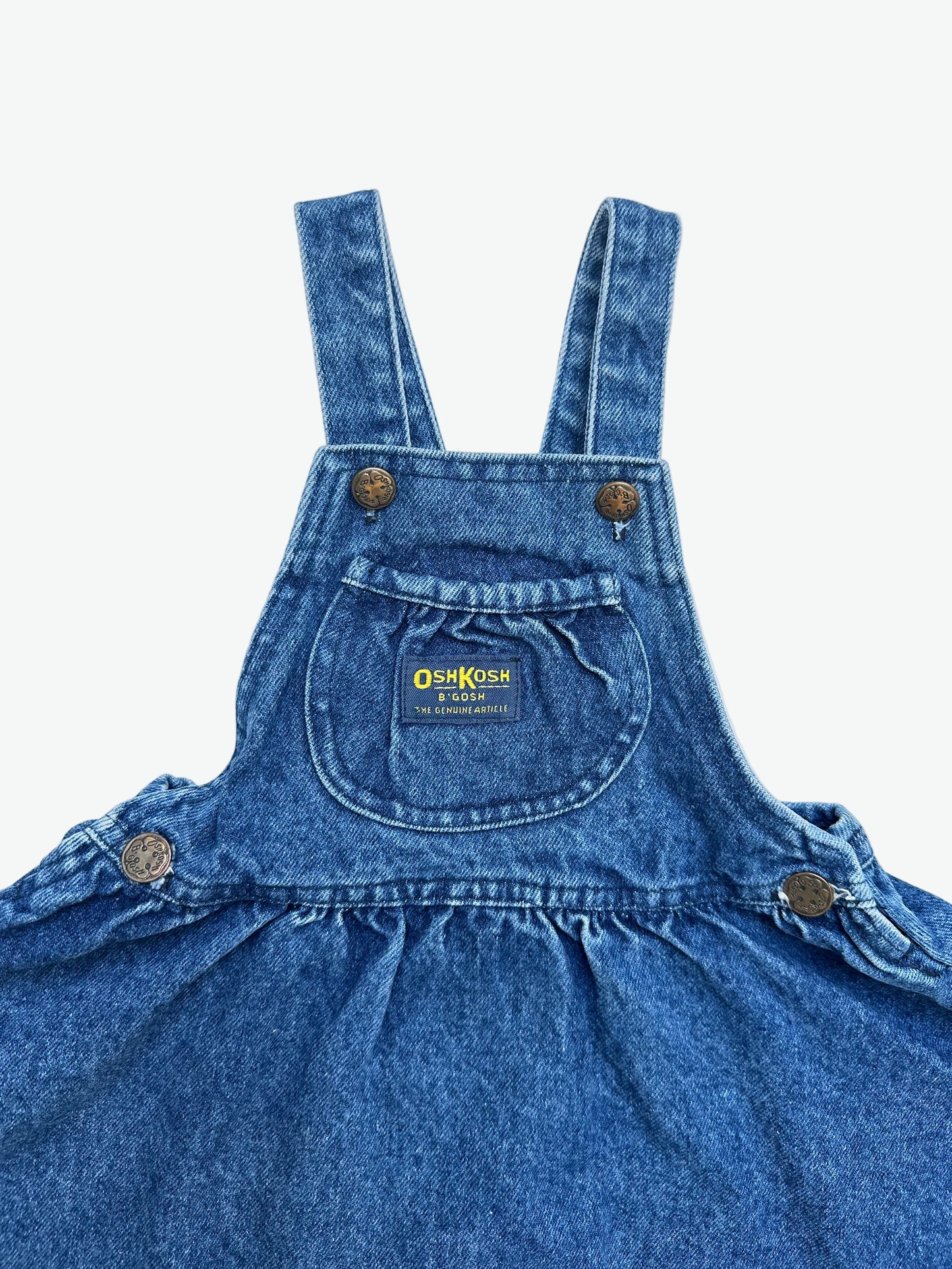 Kids vintage OshKosh dress in a thick and authentic denim fabric with antique brass trims and Oshkosh branding. Very full circle skirt.