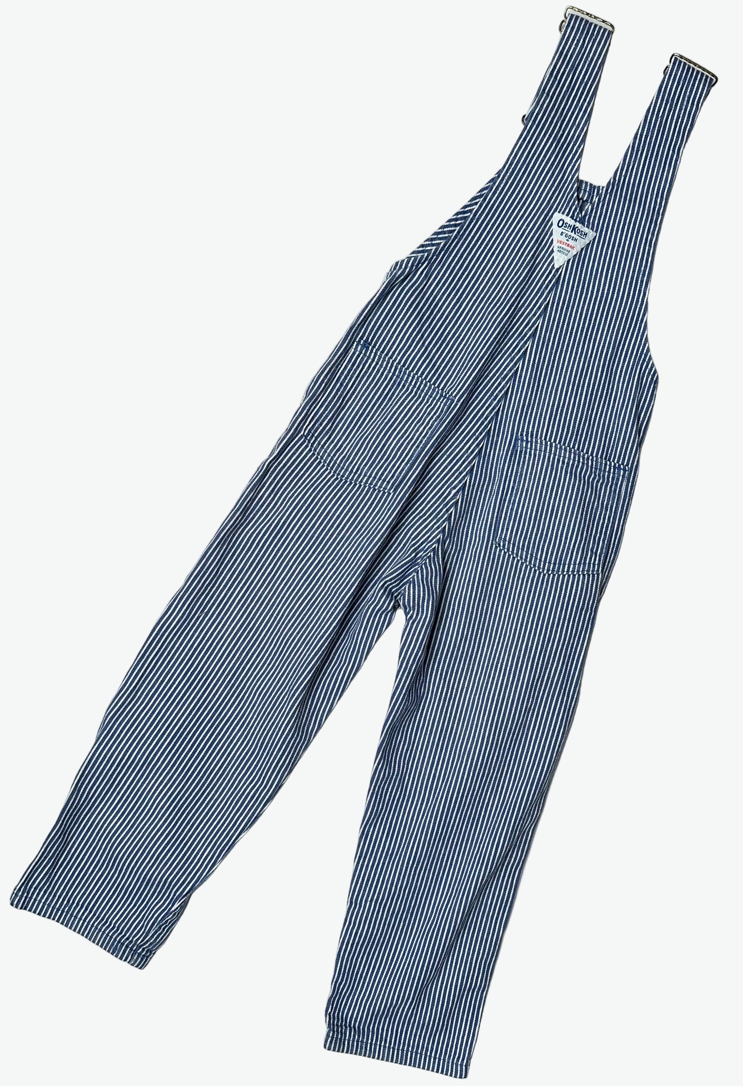 Kids vintage OshKosh dungarees in a blue and white hickory stripe with antique brass trims. Age 4 years.