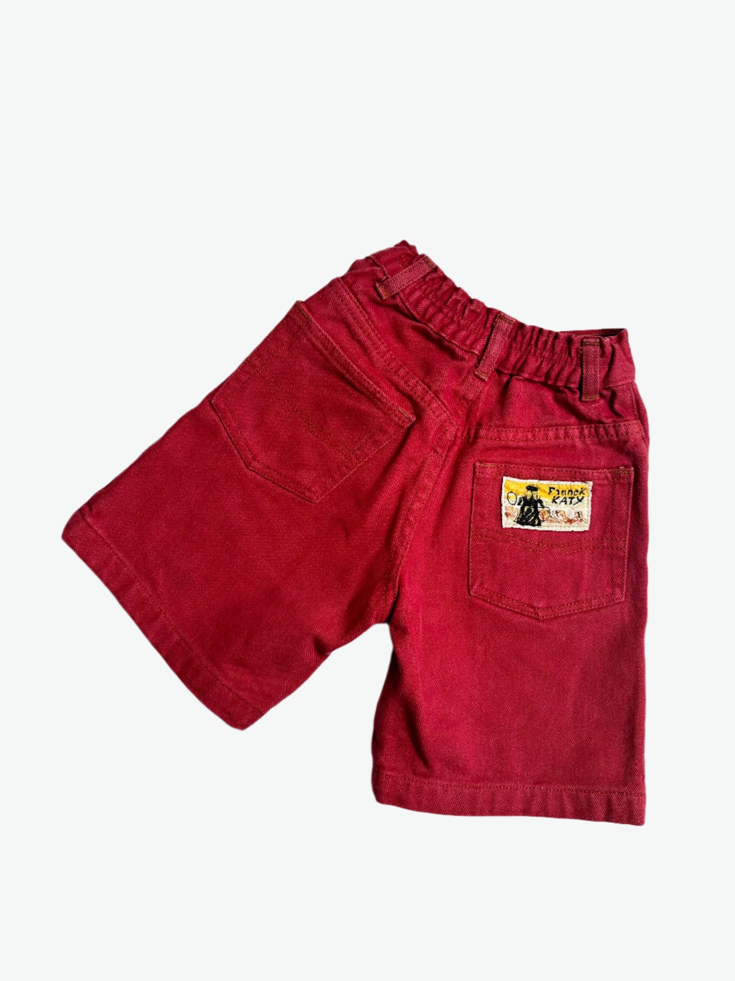 Kids vintage red denim shorts with tan stitching and badge on back pocket. Age 6 years.