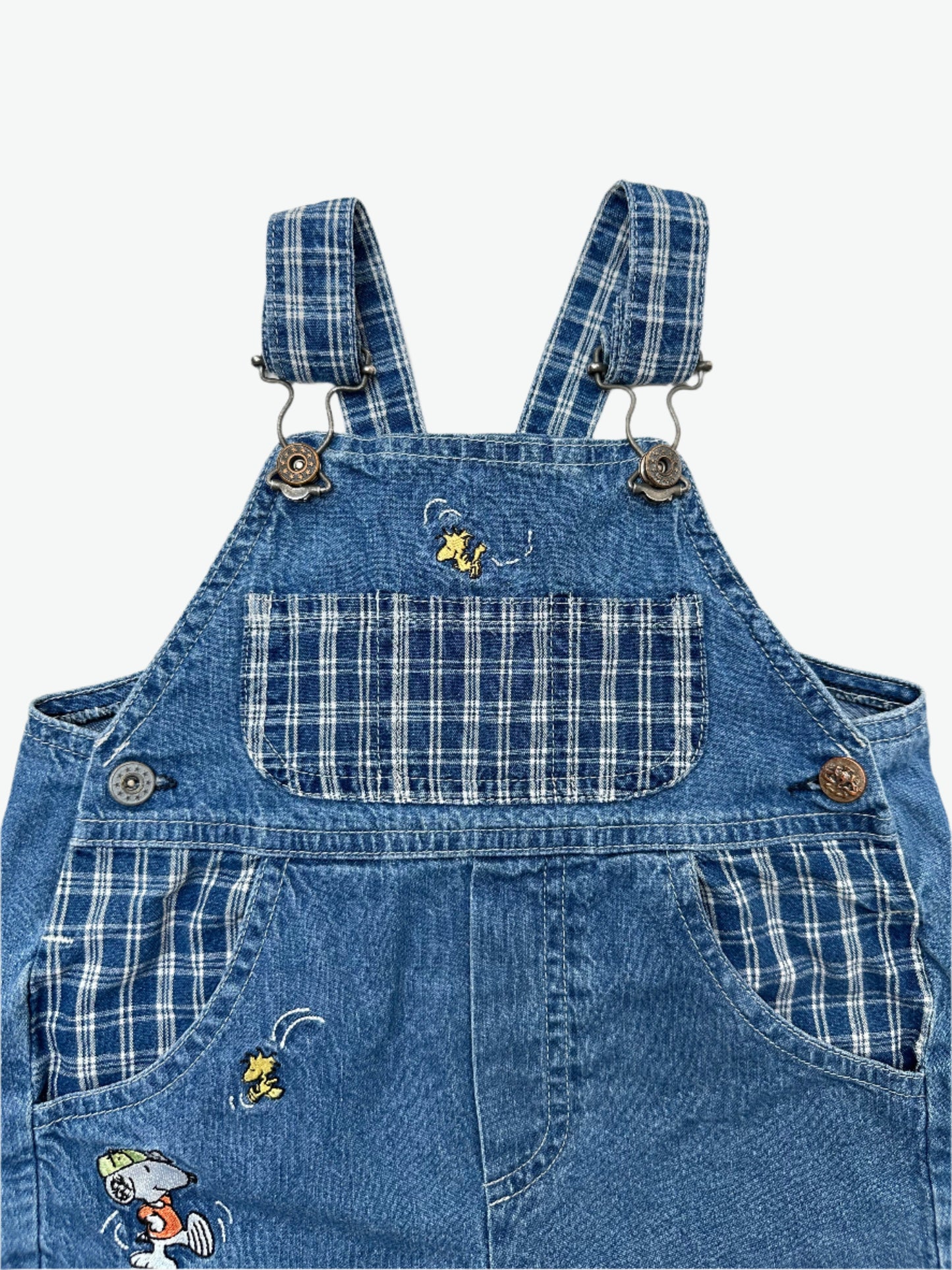 Kids vintage Snoopy lightweight denim dungarees with embroidery and check details. Classic dungaree styling with popper fastening. Age 1 years.