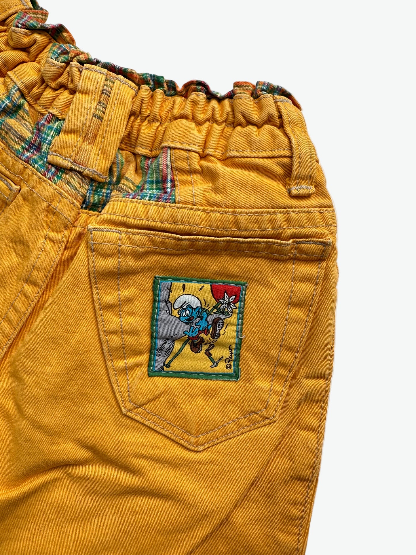 Kids vintage yellow trousers with smurf badge detail on back pocket and embroidery on the front. Tapered shape. Age 3-4 years/ 104cm.