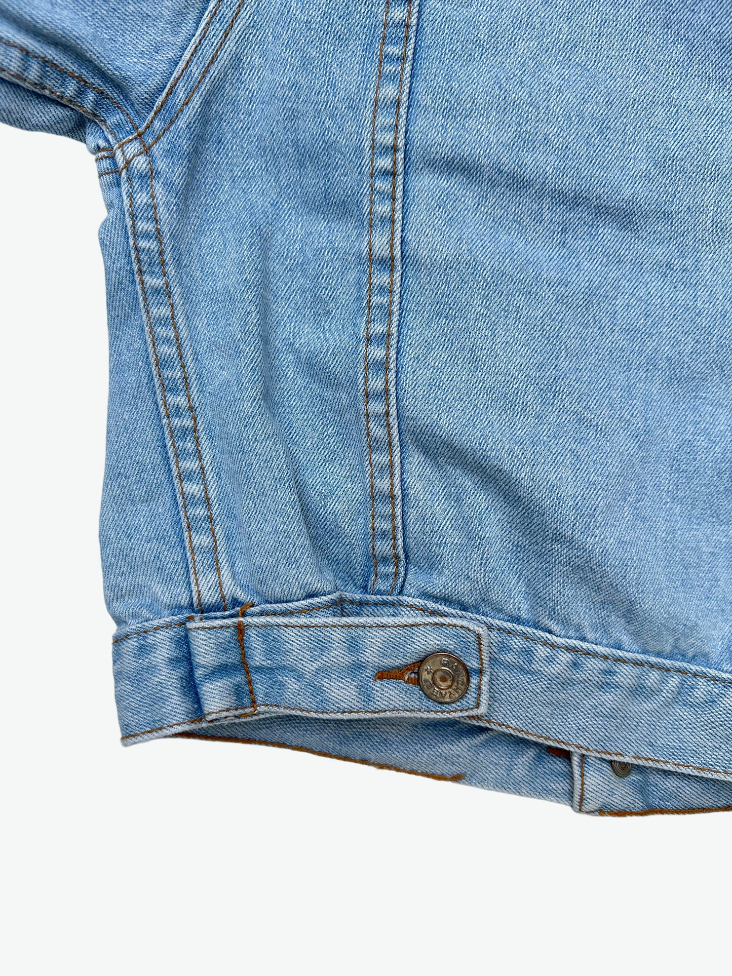 Kids vintage authentic light wash denim trucker jacket with badge details.