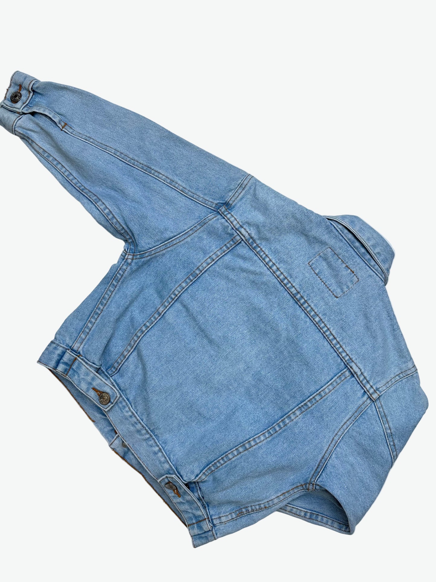 Kids vintage authentic light wash denim trucker jacket with badge details.