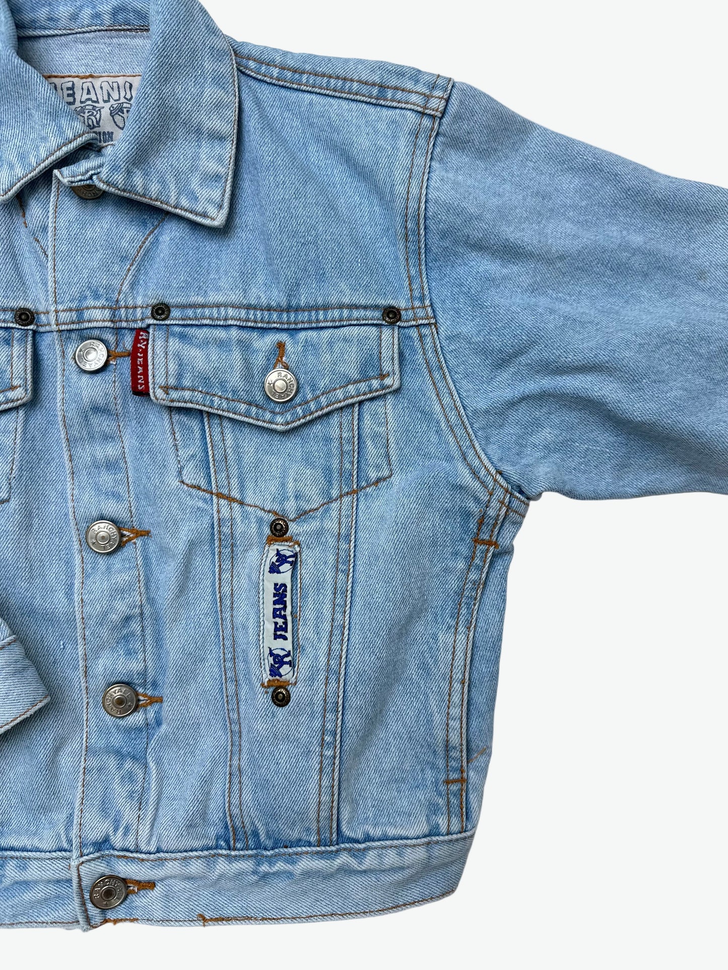 Kids vintage authentic light wash denim trucker jacket with badge details.