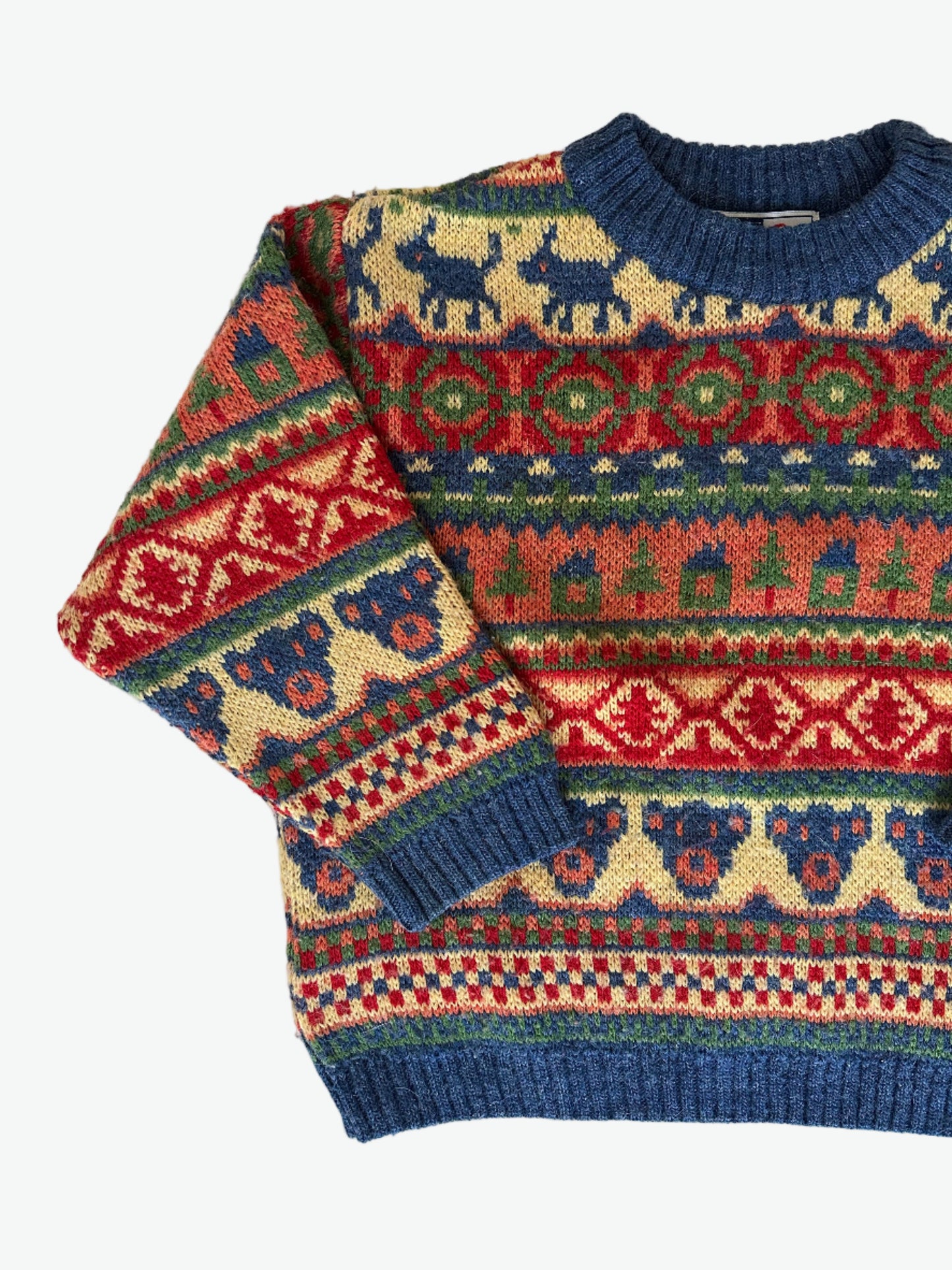 Colourful patterned sweater on a white background