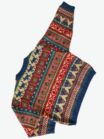 Colourful knitted jumper with pattern on a white background