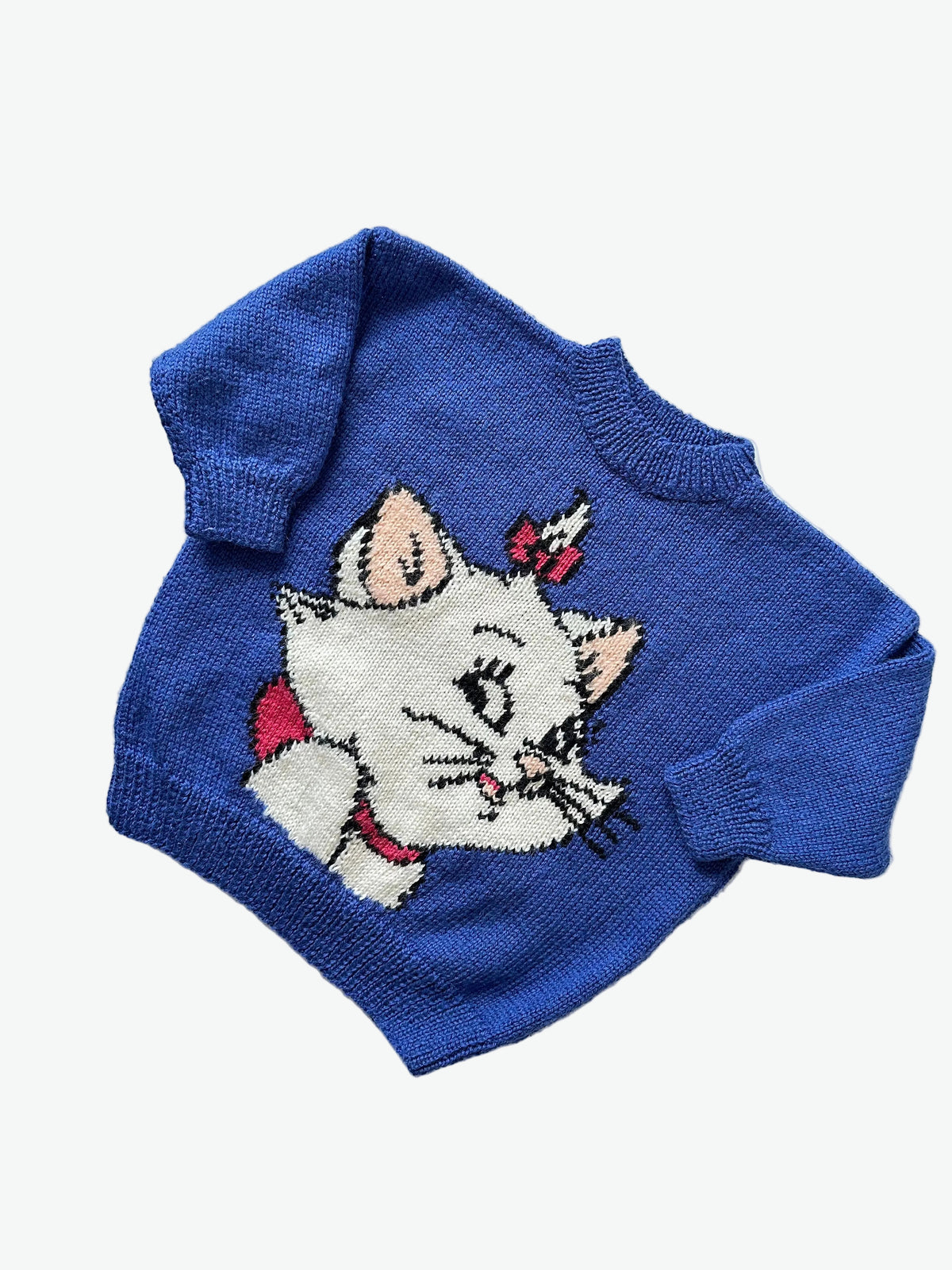 Blue knitted jumper with a cat design from disneys aristocats on a white background