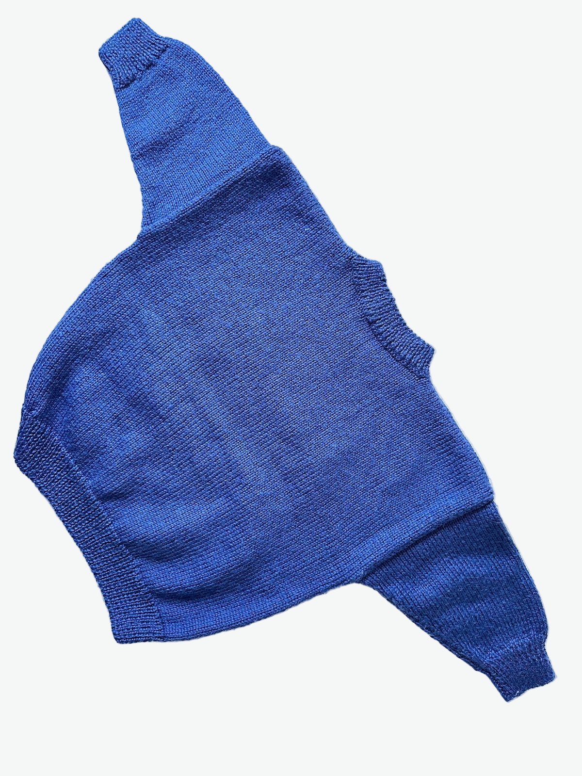 Blue hand knitted jumper on a white background