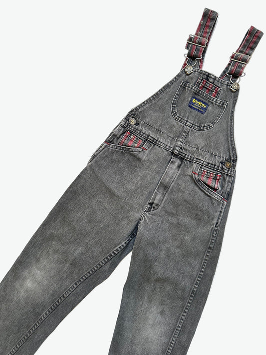 Kids vintage Grey and red denim dungarees with striped straps and Oshkosh brand label on a white background