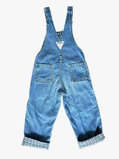 Kid vintage Oshkosh Blue denim dungarees with plaid cuffs and details on a white background