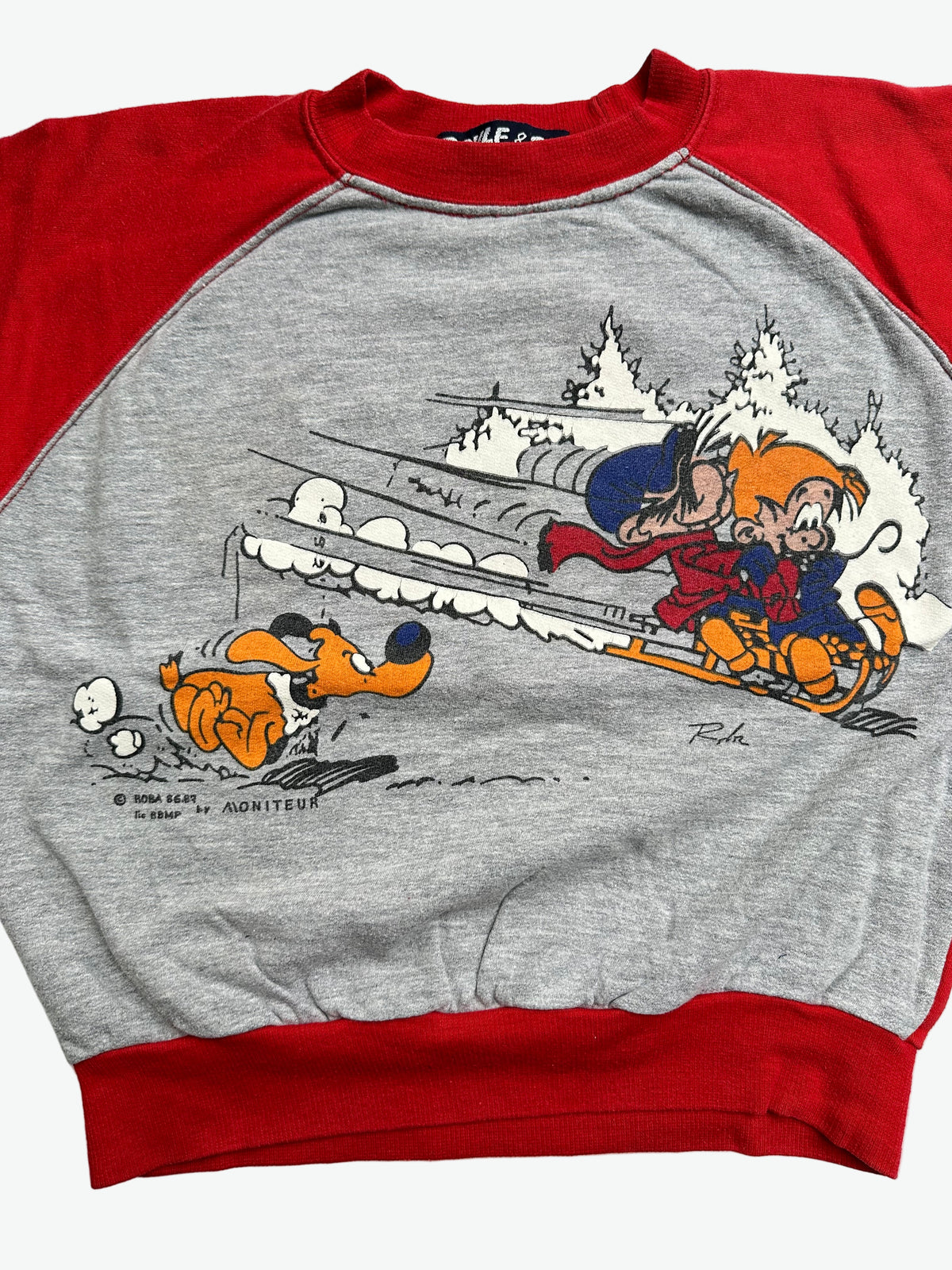 Grey and red sweater jumper with cartoon character boule & bill design on a white background