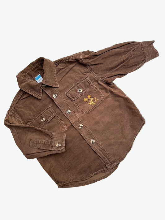 Brown baby corduroy shirt with reindeer embroidery on a white background