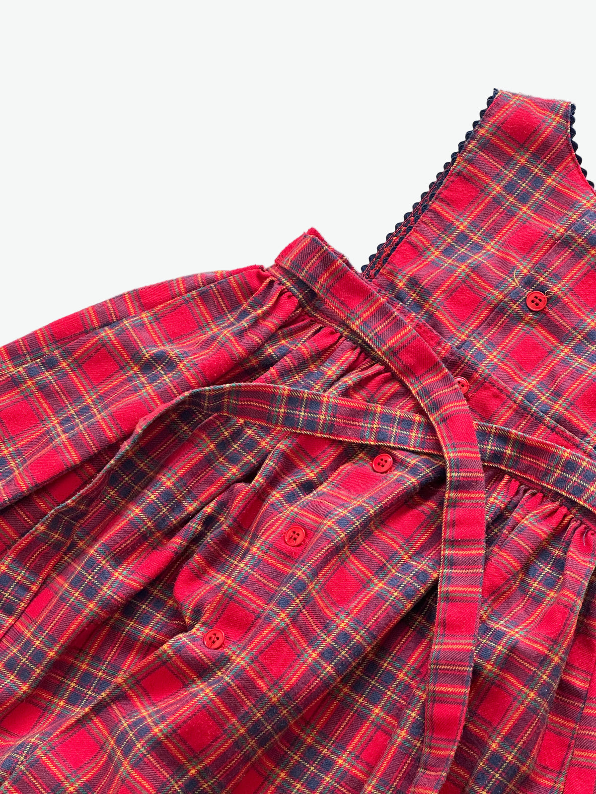 Kid vintage Red check dress button opening and waist tie on a white background