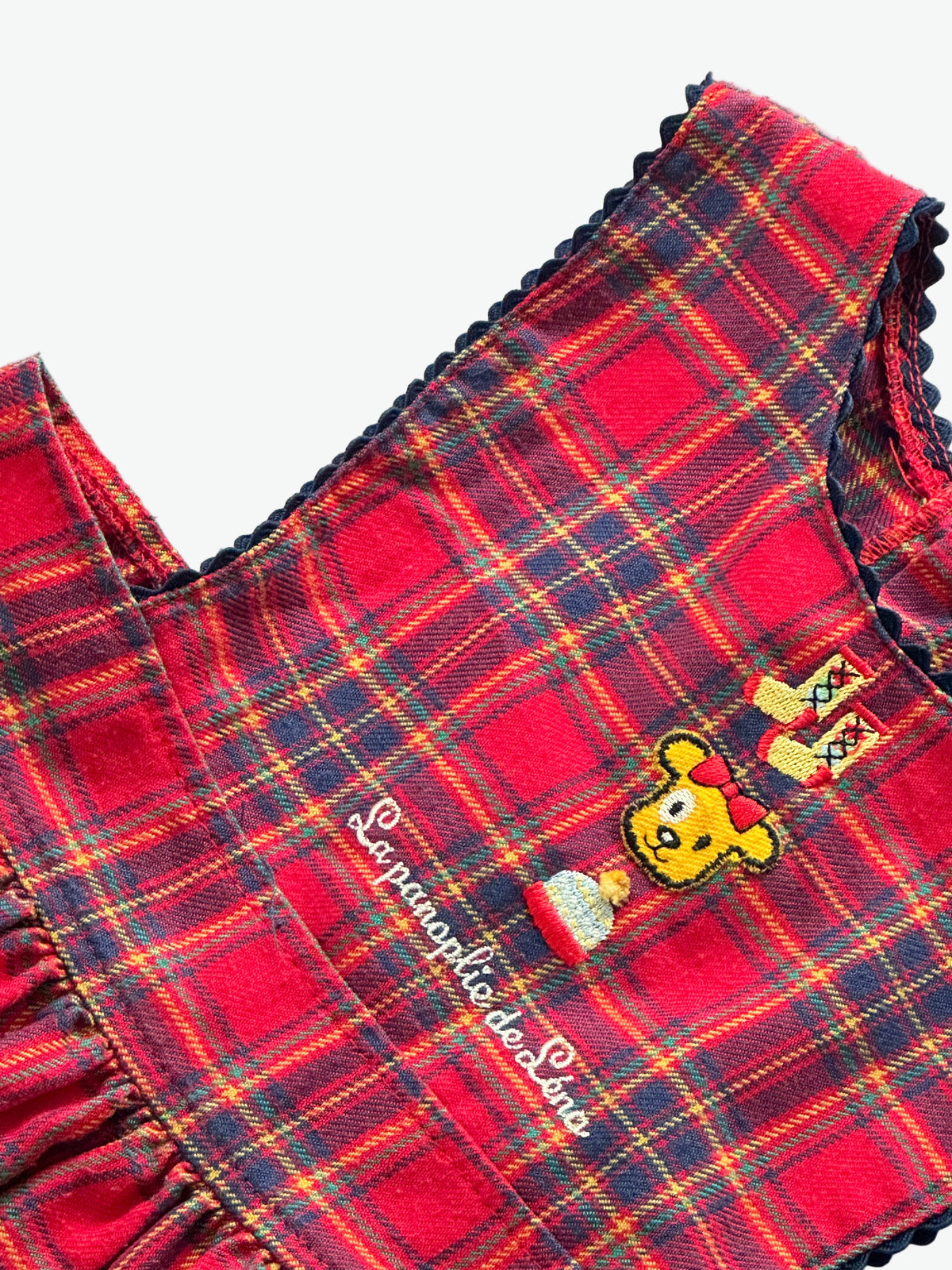Red check dress with embroidery character on the front on a white background