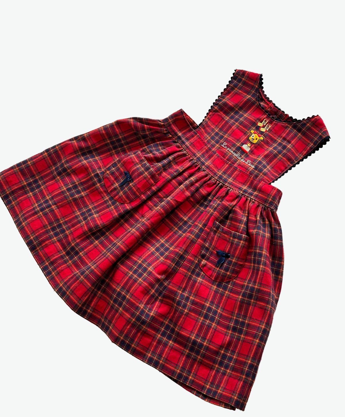 Kid vintage Red check dress button opening and waist tie on a white background