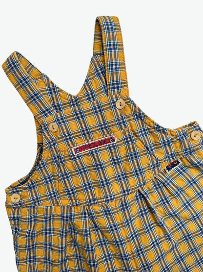 Yellow and blue Check dungarees with badge on a white background