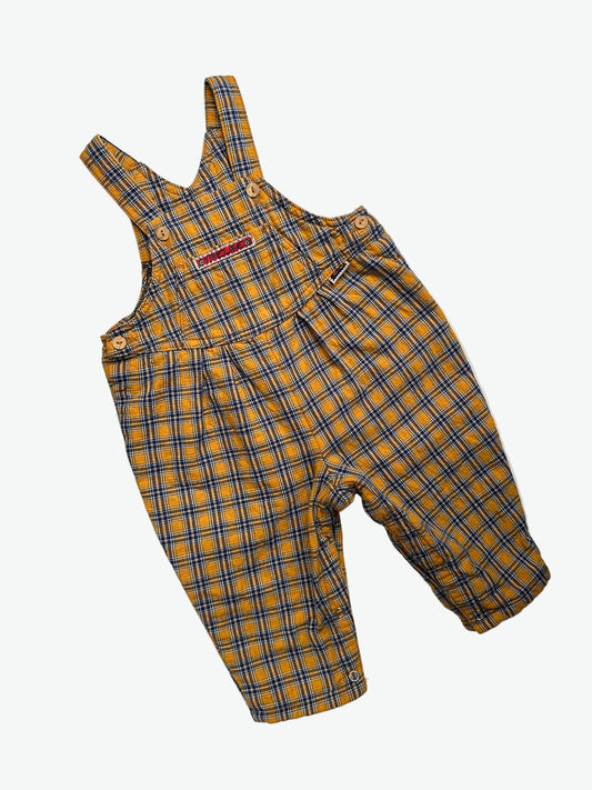 Yellow and blue Check dungarees with badge on a white background