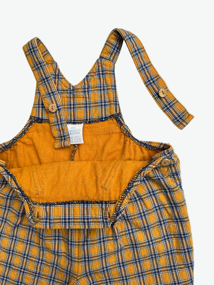 Yellow and blue check dungarees on a white background