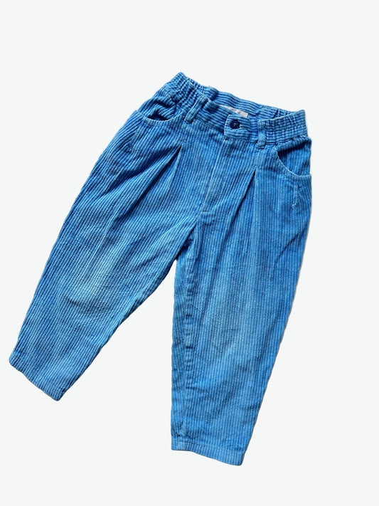 kids vintage cornflower blue corduroy trousers on a white background