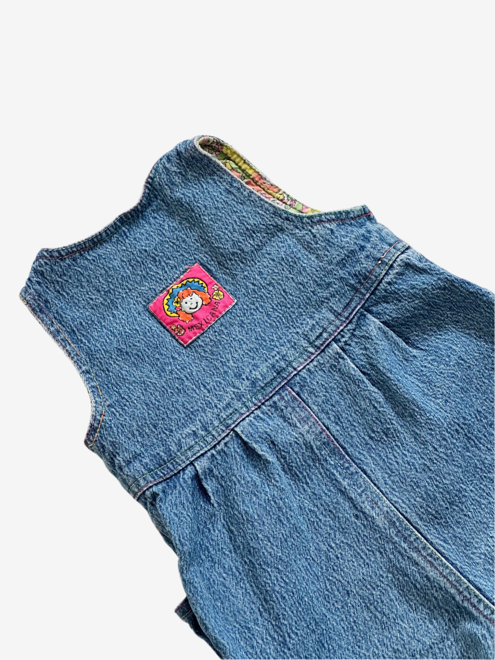 Kids vintage 90's Acid Wash Denim Romper  from British brand Adams, with rainbow stitching, pink buttons and a jazzy lining. Age 12 Months.