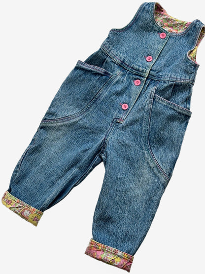 Kids vintage 90's Acid Wash Denim Romper  from British brand Adams, with rainbow stitching, pink buttons and a jazzy lining. Age 12 Months.