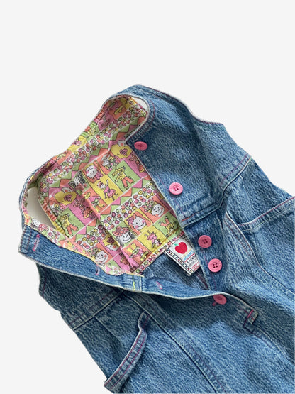 Kids vintage 90's Acid Wash Denim Romper  from British brand Adams, with rainbow stitching, pink buttons and a jazzy lining. Age 12 Months.