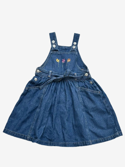 Kids vintage Denim Dress from British brand Adams from the 90s. Adjustable button strap closure with a full a-line skirt perfectly girly with simple flower embroidery at the front, flower embossed buttons and tie.Age 18-24 Months.