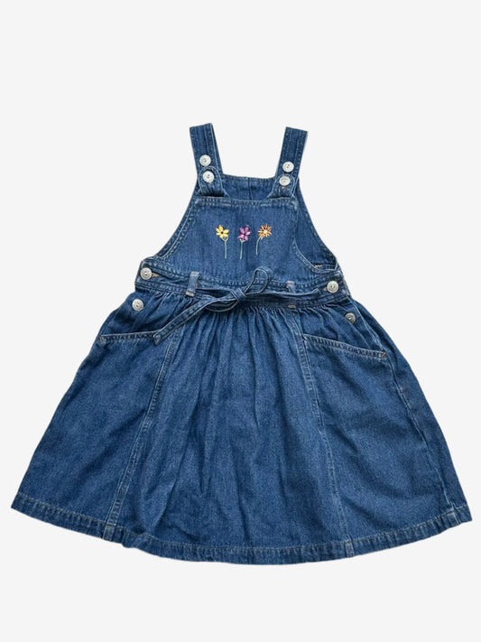 Kids vintage Denim Dress from British brand Adams from the 90s. Adjustable button strap closure with a full a-line skirt perfectly girly with simple flower embroidery at the front, flower embossed buttons and tie.Age 18-24 Months.