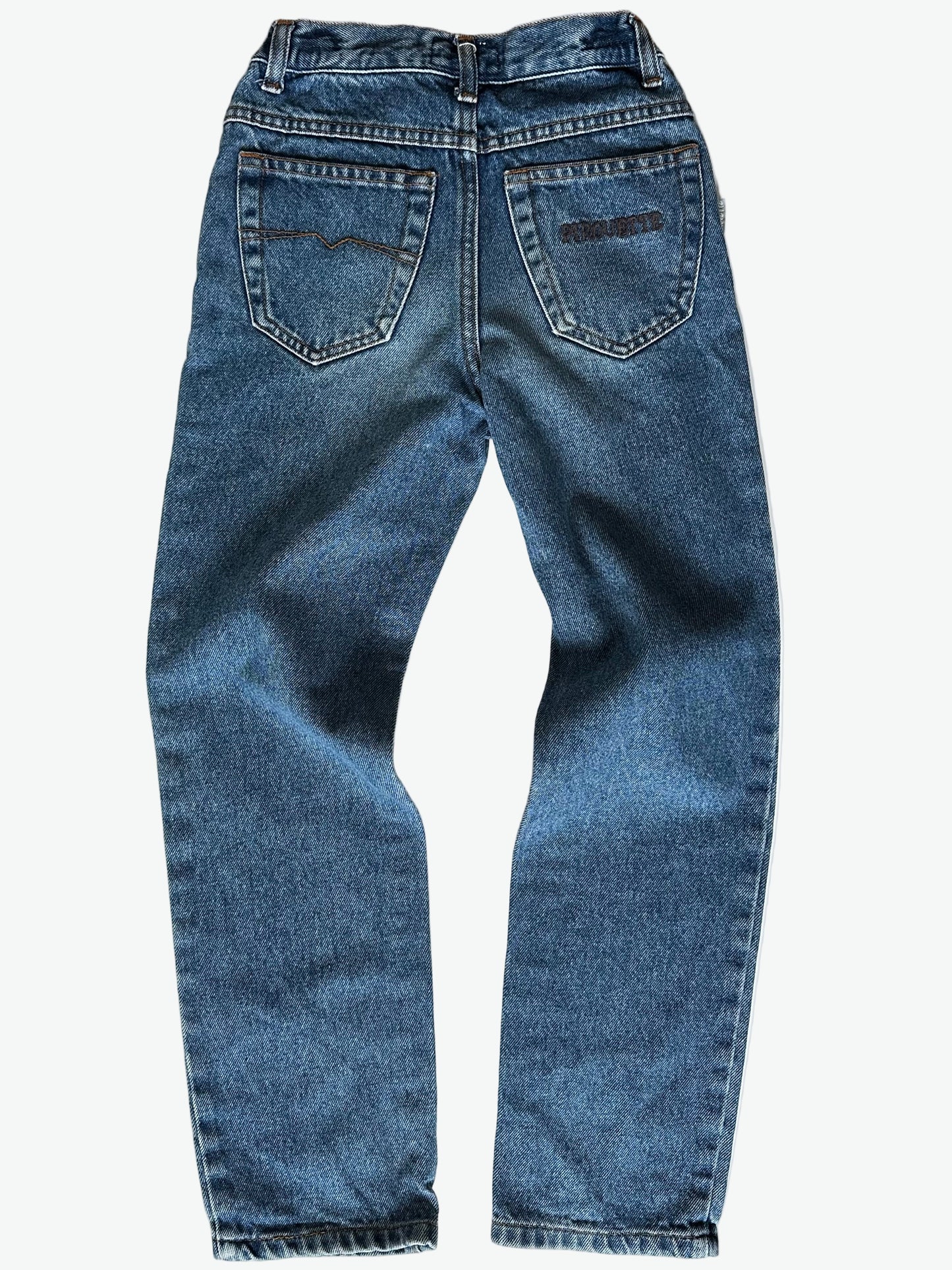 Pair of authentic blue jeans with back pocket embroidery and silver hardware on a white background