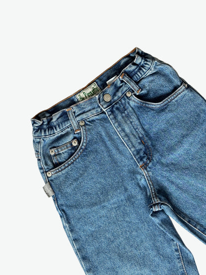 Pair of authentic blue jeans with silver hardware on a white background.