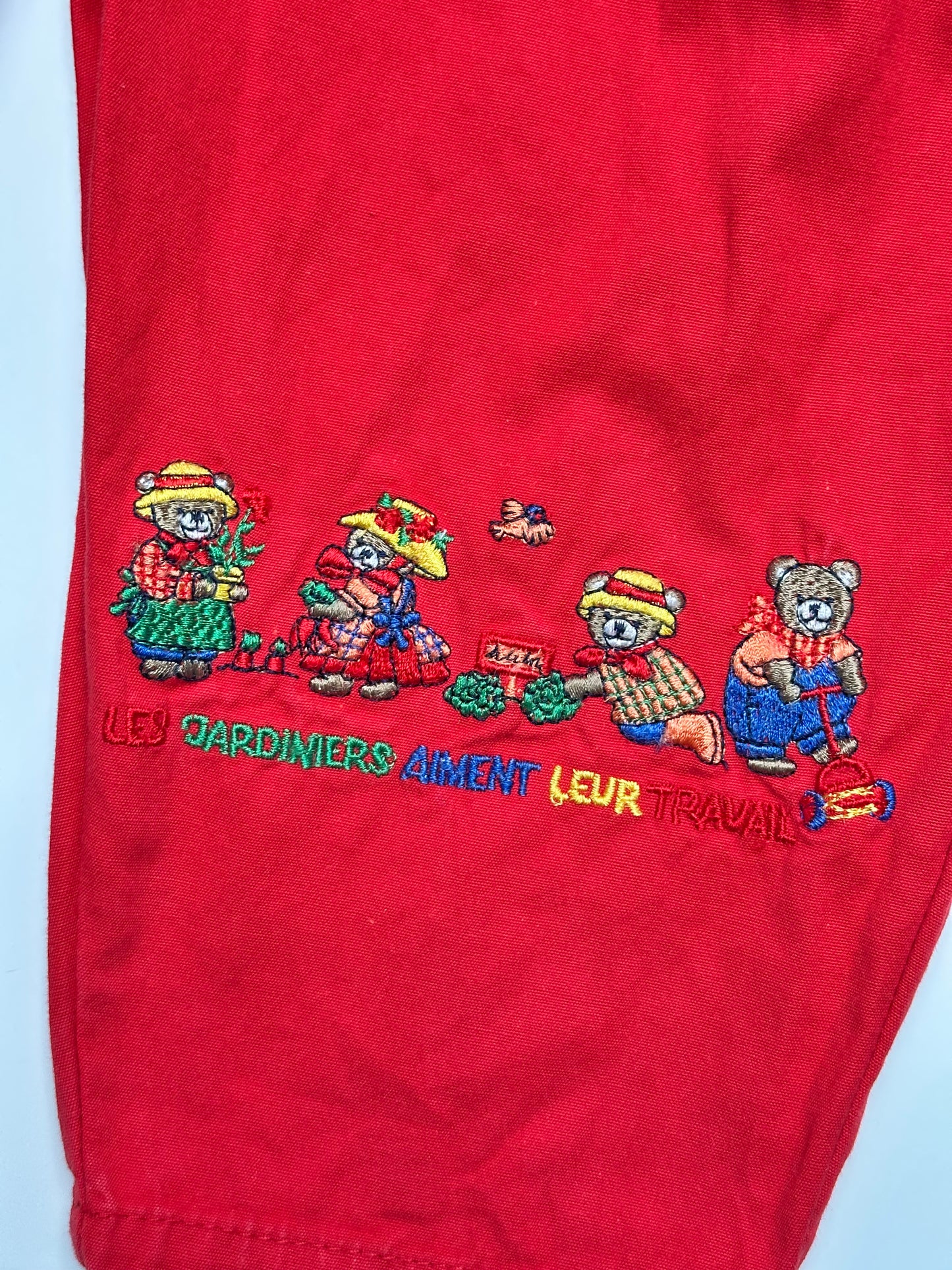 Kids vintage bold red with a relaxed bubble fit, featuring beautifully detailed embroidery or a bear tending the garden. Age 1 years.