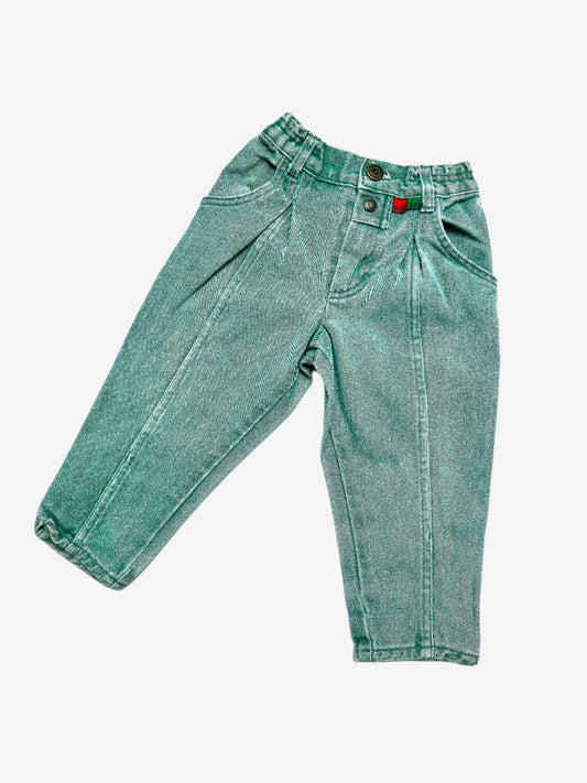 Kids vintage green denim jeans by Kickers, featuring an elasticated waist and button opening for an easy fit, the front darts and extra seams highlight the stunning wash effects, finished with the signature red and green Kickers tabs. Age 2 years.