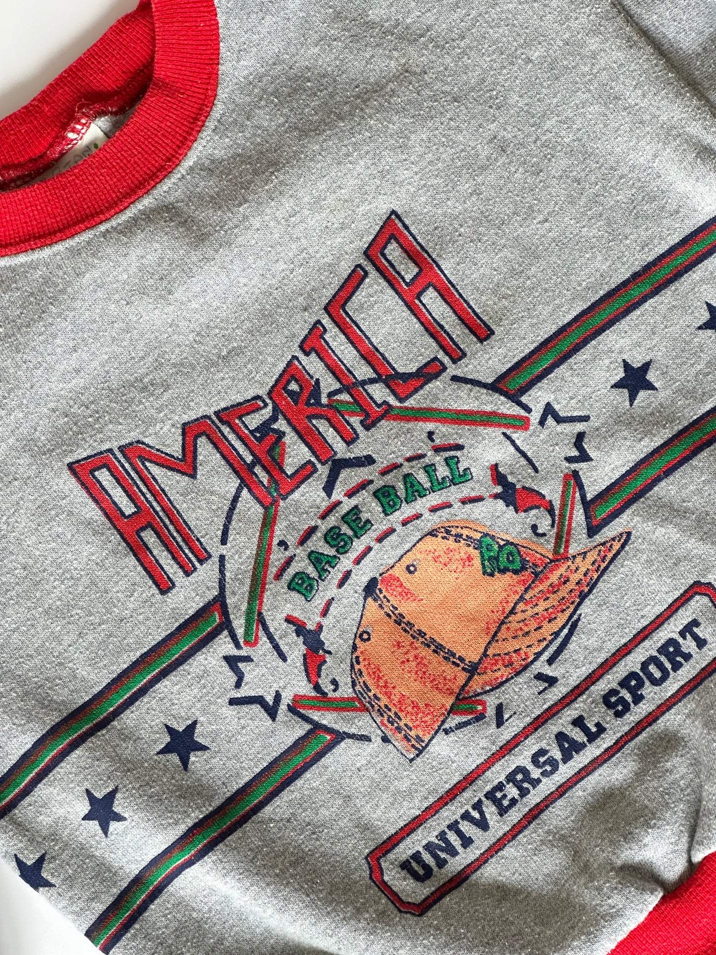 Kids vintage grey america basball sweatshirt jumper with red accents and a logo on a white background