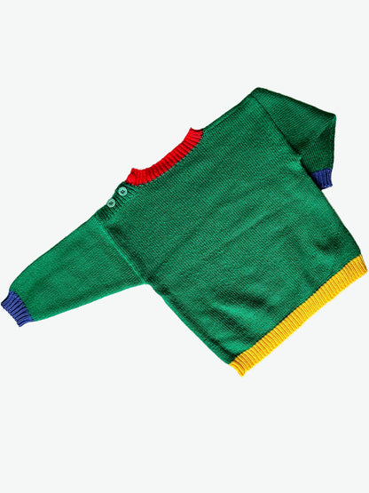 Green hand knit jumper with blue yellow and red details and with miffy/nijntje character and kite design on a white background.
