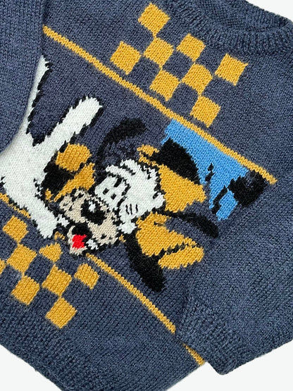 Kids vintage hand knitted jumper with a Goofy and checkerboard design on the front on a white background