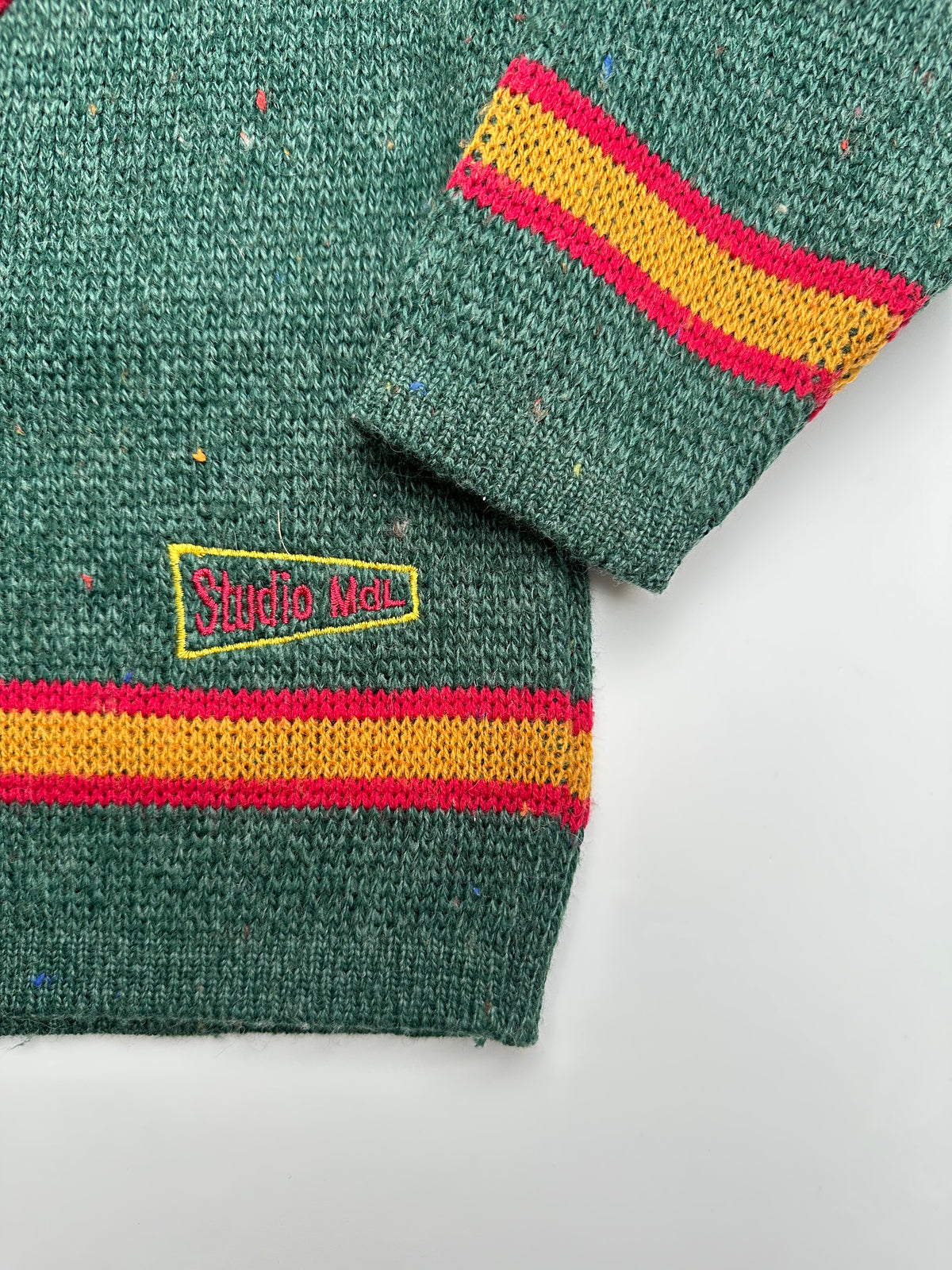 Kids vintage Green jumper with red and yellow stripes on a white background