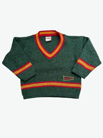 Green jumper with red and yellow accents on a white background