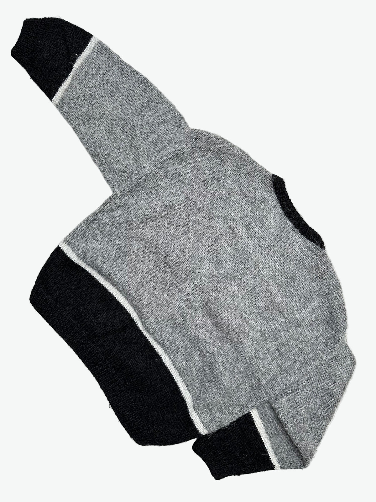 The back of Grey and Black Knitted Cardigan with the cartoon characters Sylvester Cat and Tweety Bird.