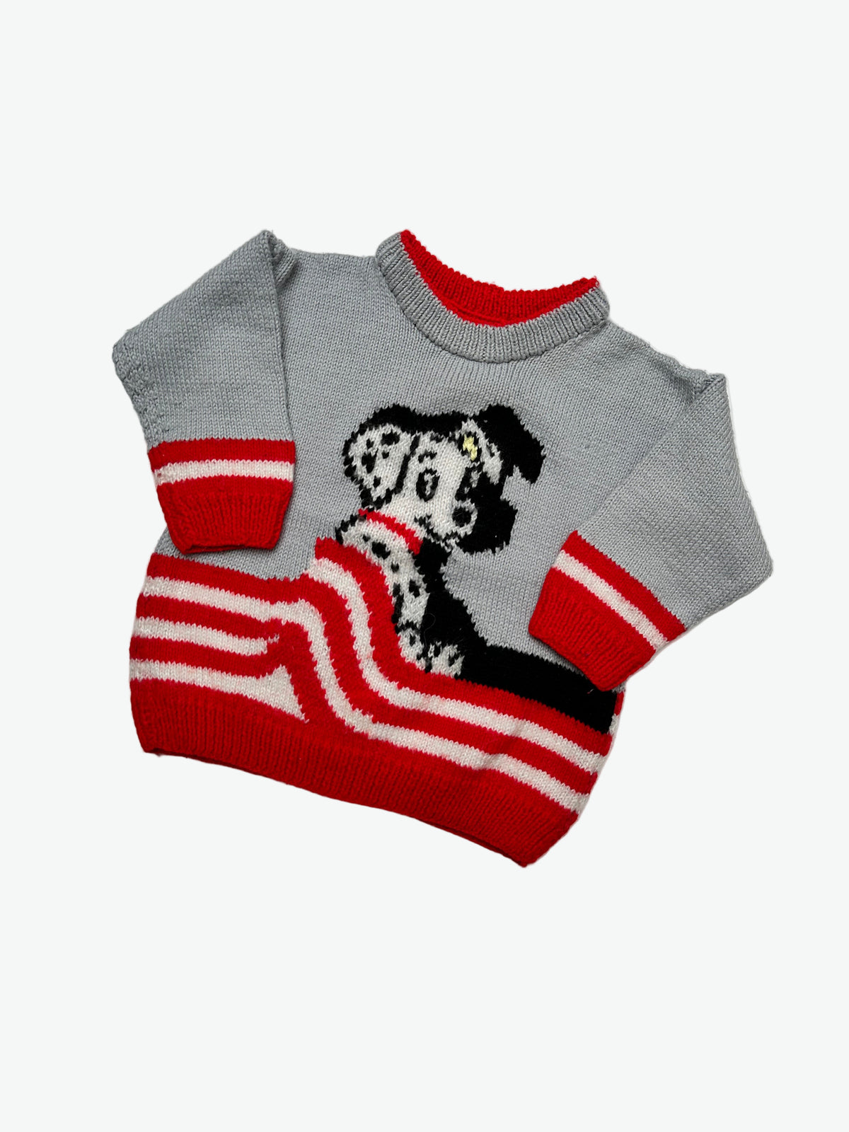 Grey Hand knitted 101 Dolmatians jumper with red and white pattern on a light gray background.