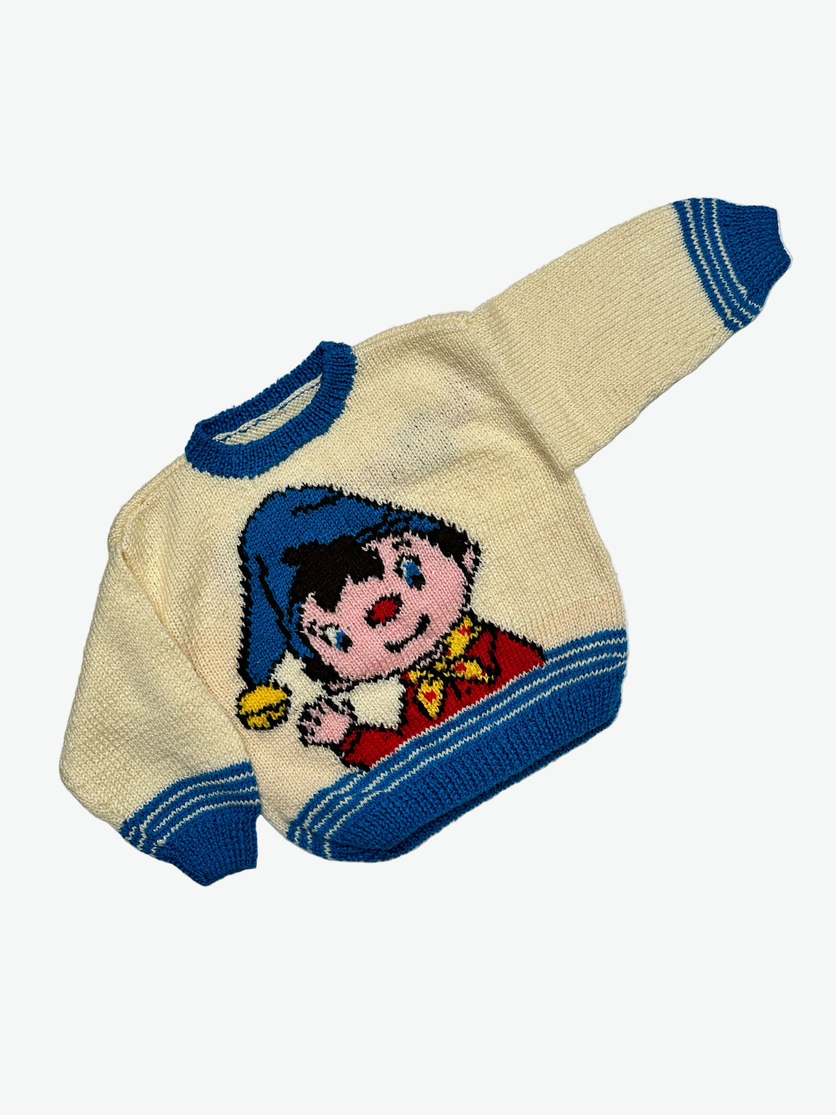 Kids vintage cream knitted jumper with the character knoddy and blue stripes at the hem and cuffs on a white background