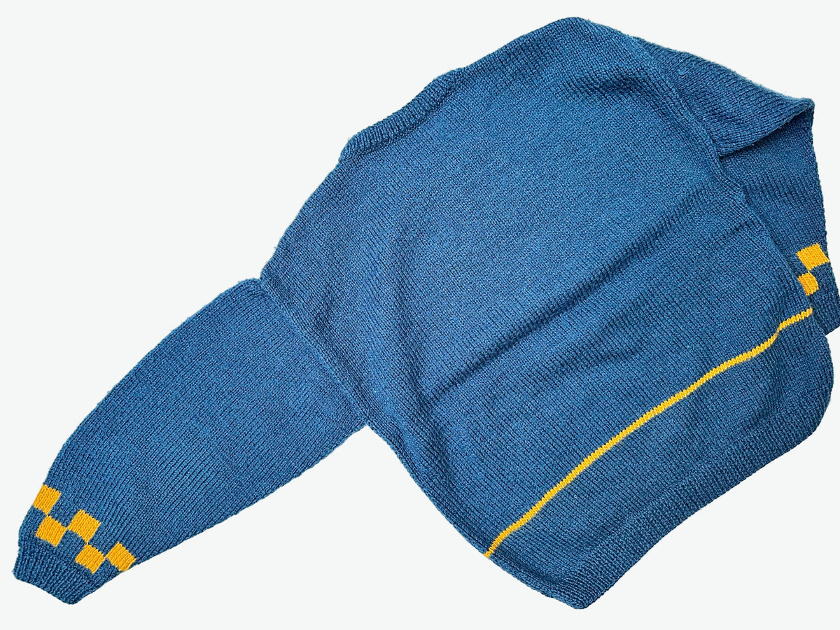 Kids vintage Blue knitted jumper with yellow pattern on a light gray background