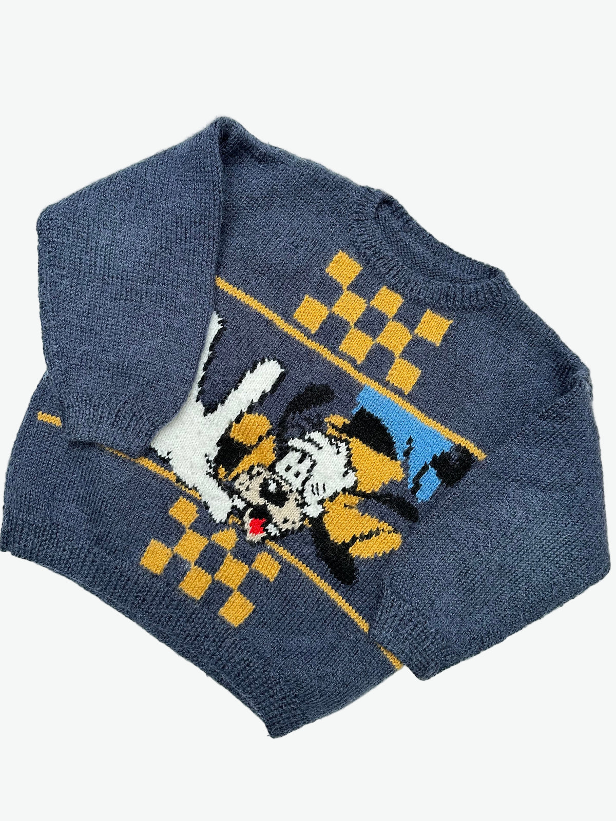 Kids vintage blue hand knitted jumper with a character design of dingo on a light gray background